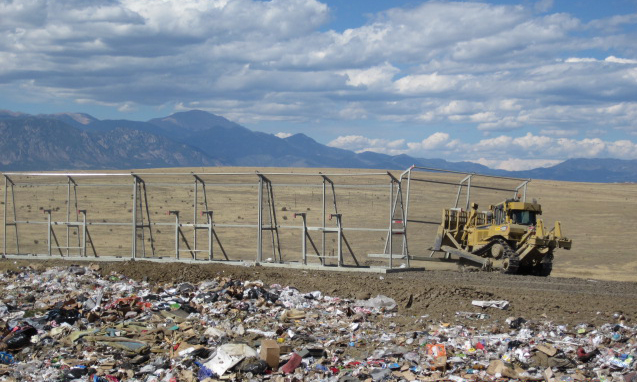 Front-end loader continuing to place The BULL fencing.